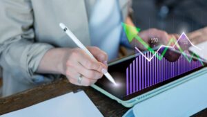Business professional reviewing emergency fund strategy on a digital tablet with Canadian financial charts