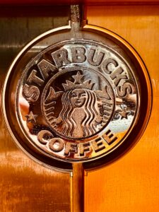 Starbucks' journey from a small Seattle coffee shop to a global coffeehouse chain is a testament to its emphasis on customer experience, store design, and community engagement as key elements in its marketing success.